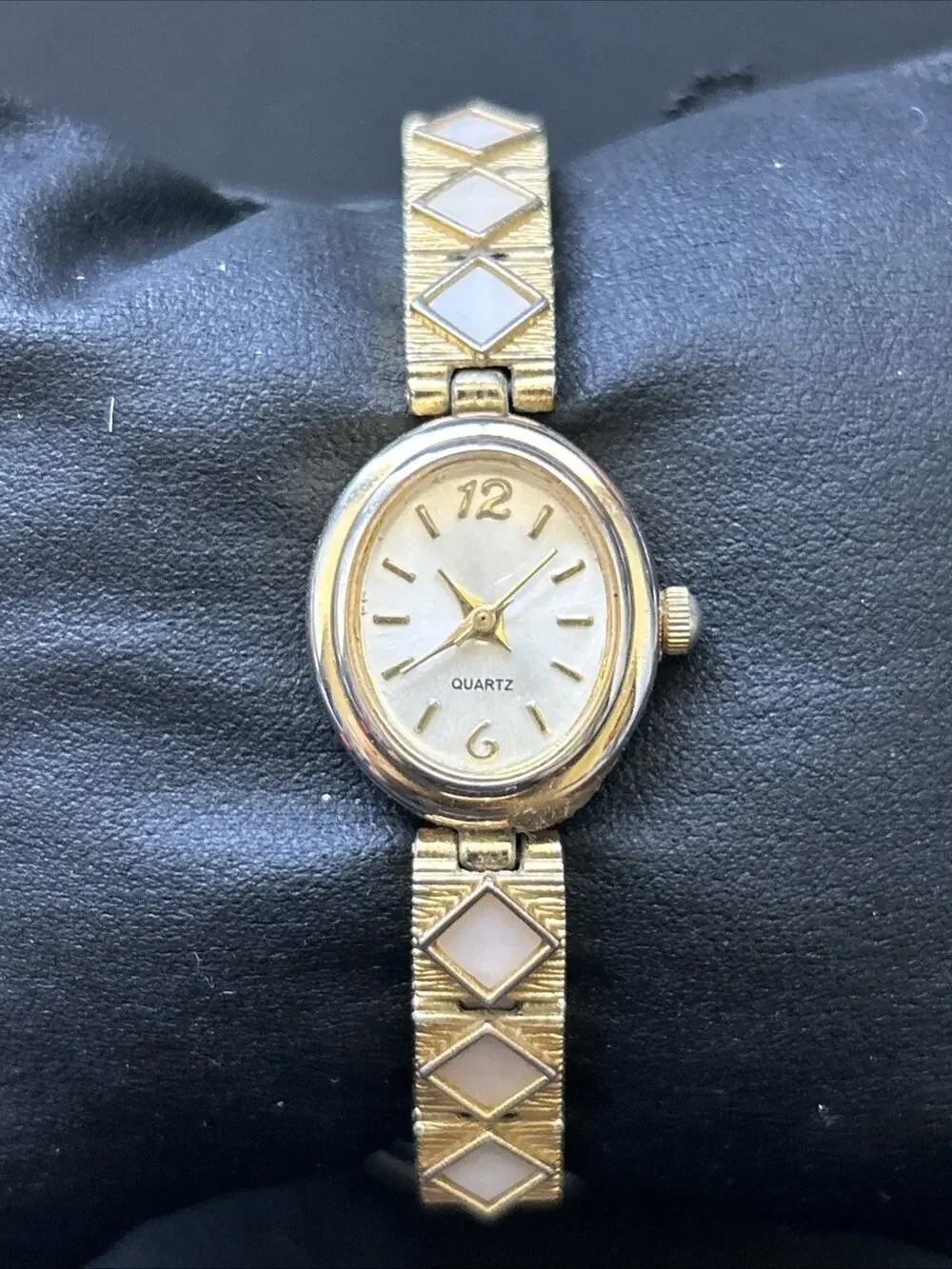 Gold Tone Oval Case Women’s Stretch Band Quartz Watch
